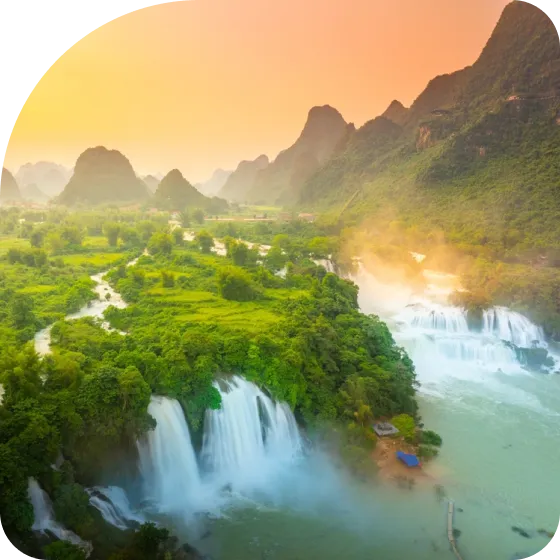 An aerial view of a waterfall in the jungle.