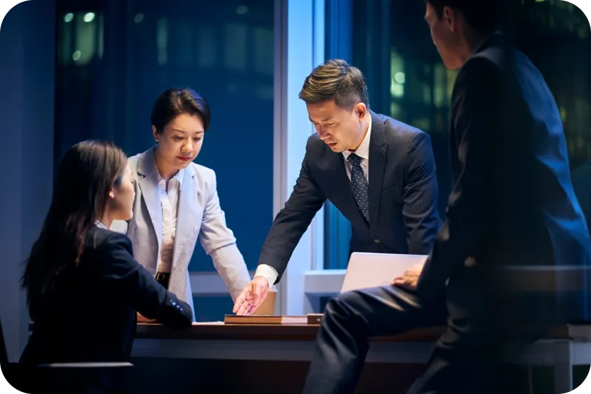 A man discussing to a team over a table