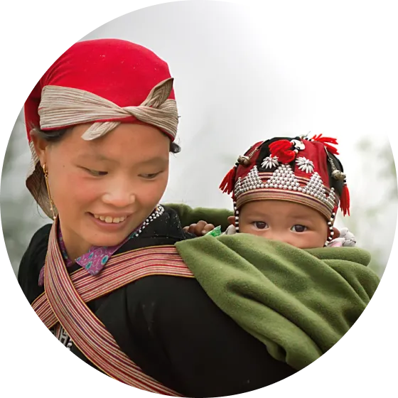 A woman holding a child in her arms.