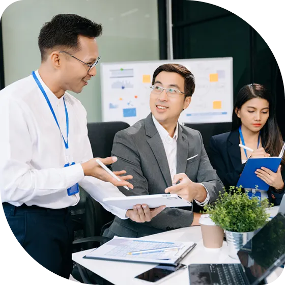 A group of people sitting around a table.
