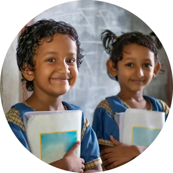 A couple of kids standing next to each other.